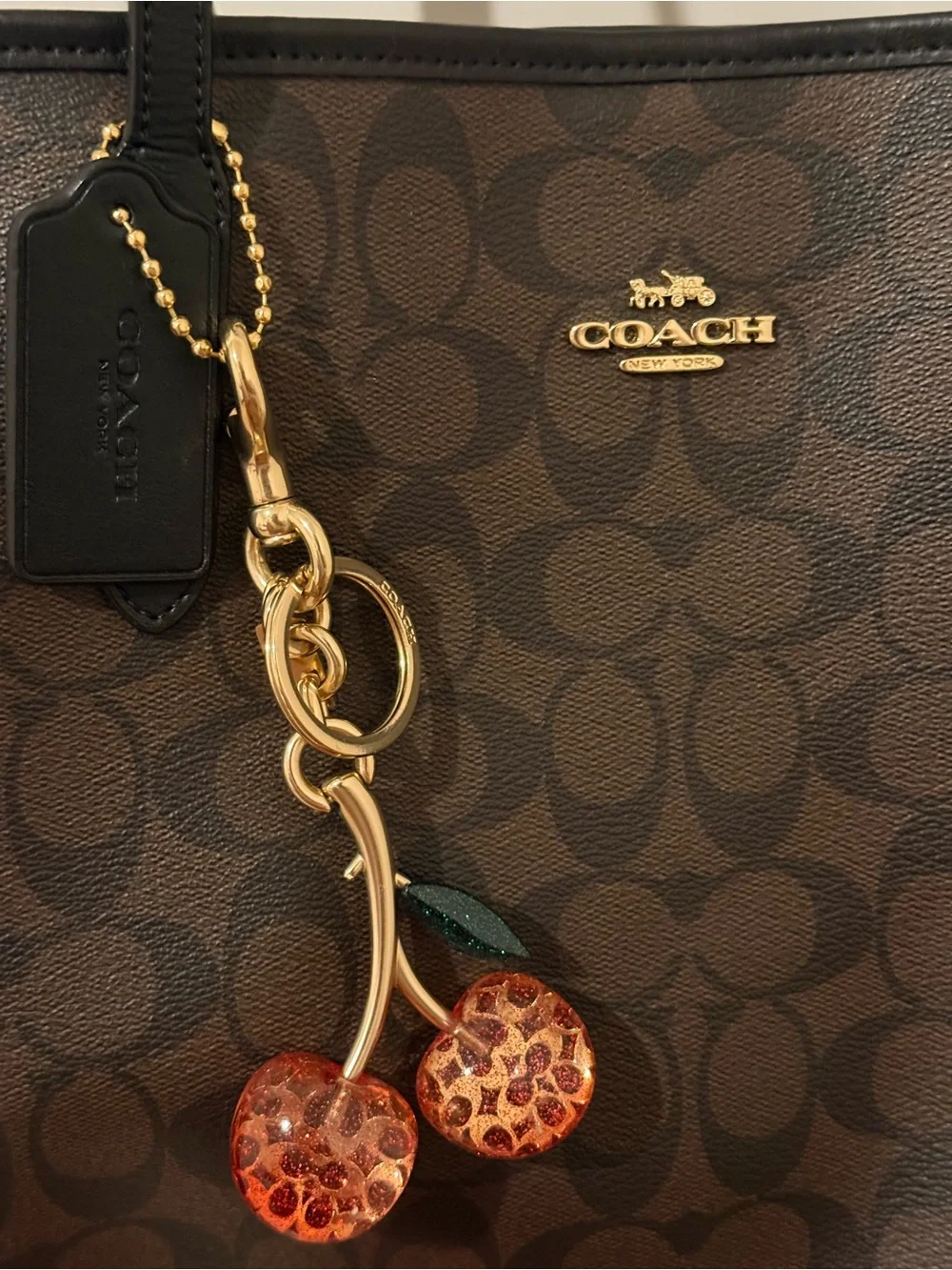 Coach Brown Logo Canvas Tote with Black Straps and Cherry Charm